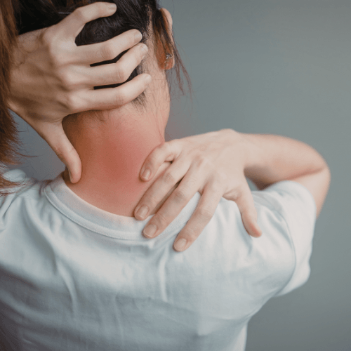 Person holding the back of the neck with highlighted pain indicating a cervicogenic headache.