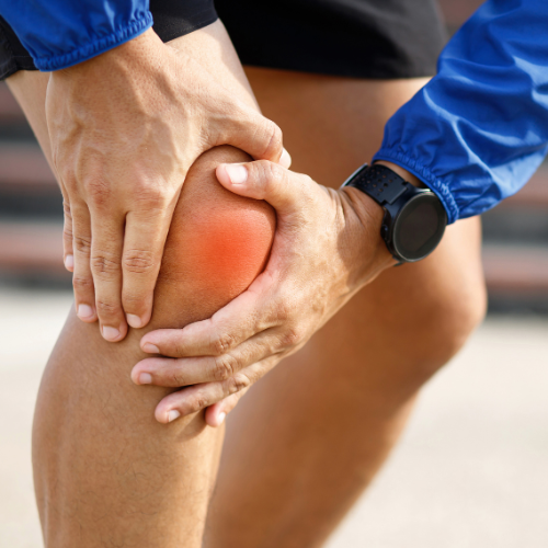 Person holding the knee with highlighted pain indicating tibiofemoral knee osteoarthritis.