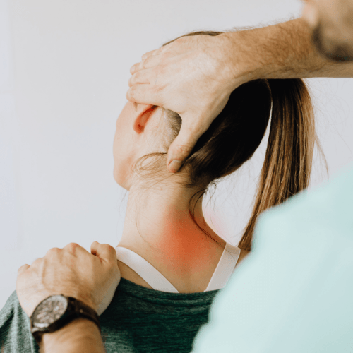 Chiropractor performing a cervical spine adjustment on a patient with neck pain.